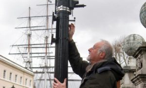 No to Silvertown Tunnel campaigner sets up a monitor near the Cutty Sark in Greenwich