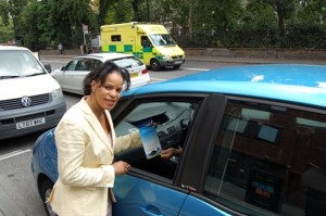 Cllr Claudia Webbe hands out Switch Off Your Engine leaflets to idling motorist