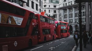 three red double decker buses