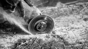 Close-up of Person Cutting Steel with Electric Tool