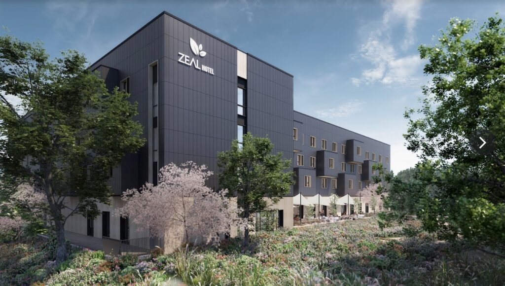Vertical solar panels cover three walls of net zero hotel