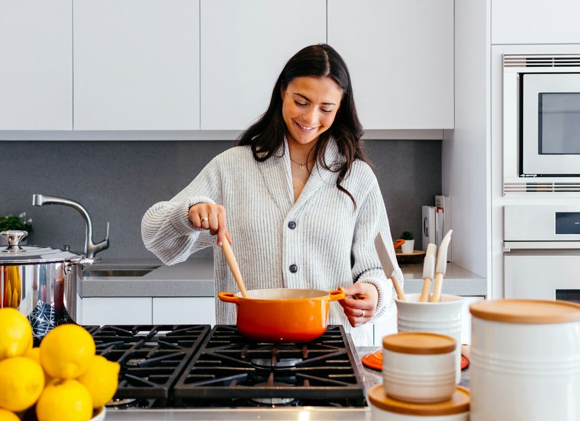 woman cooking inside kitchen room