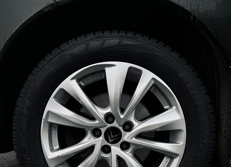 silver 5 spoke wheel with tire