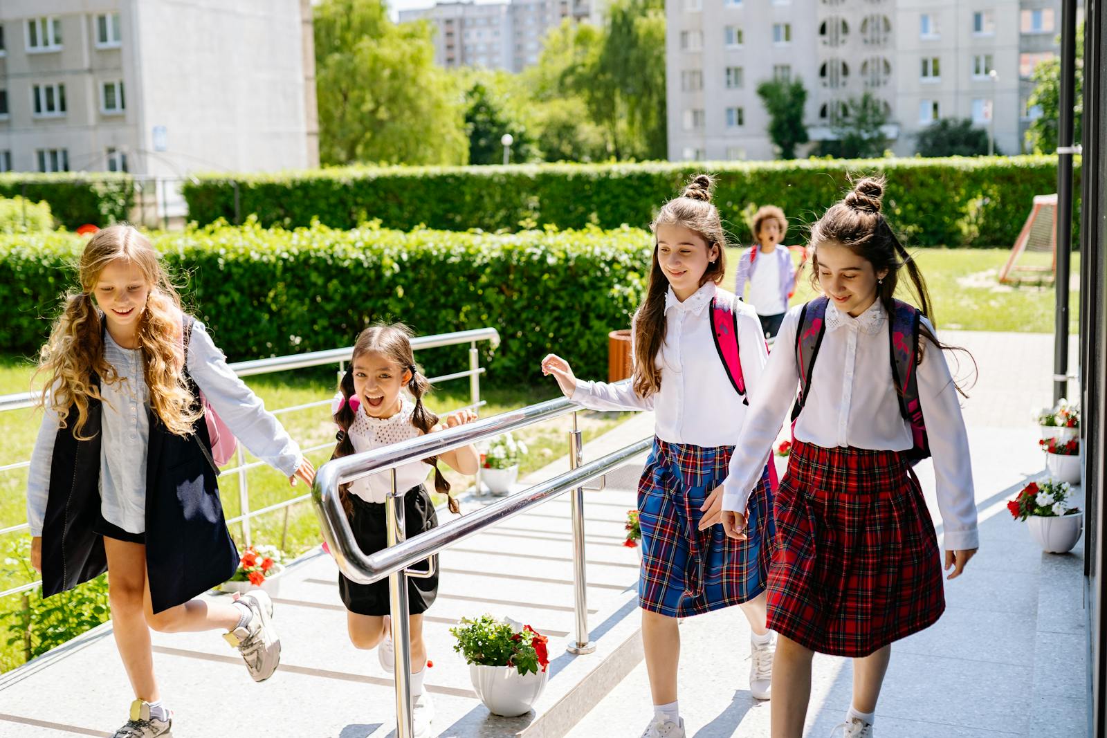 Joyful group of kids heading to school on a sunny day, ready to learn and have fun together.