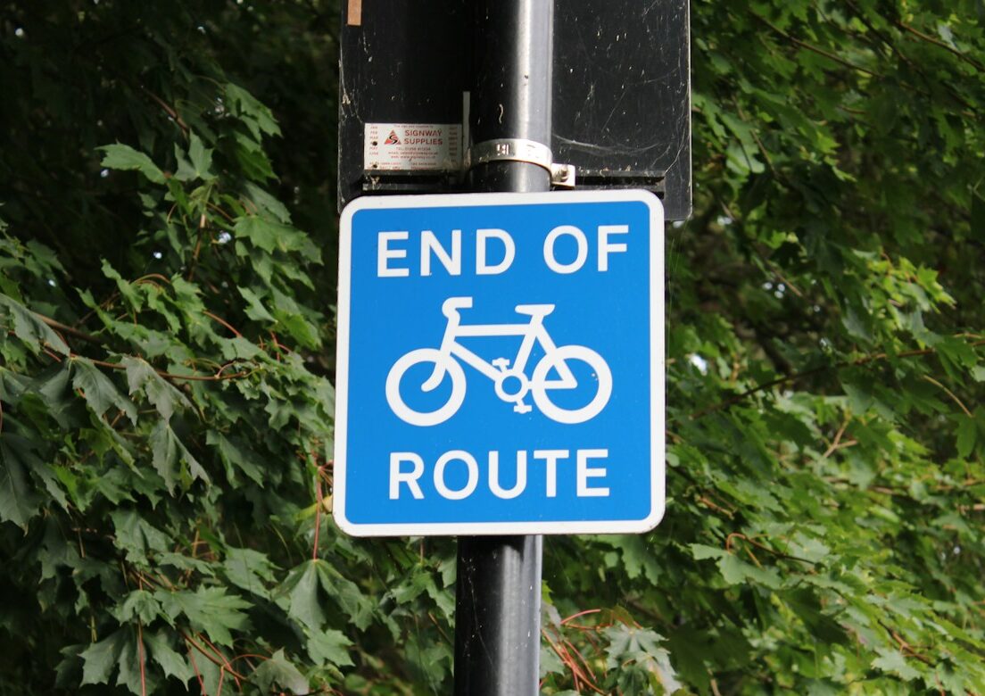 a blue sign with white text