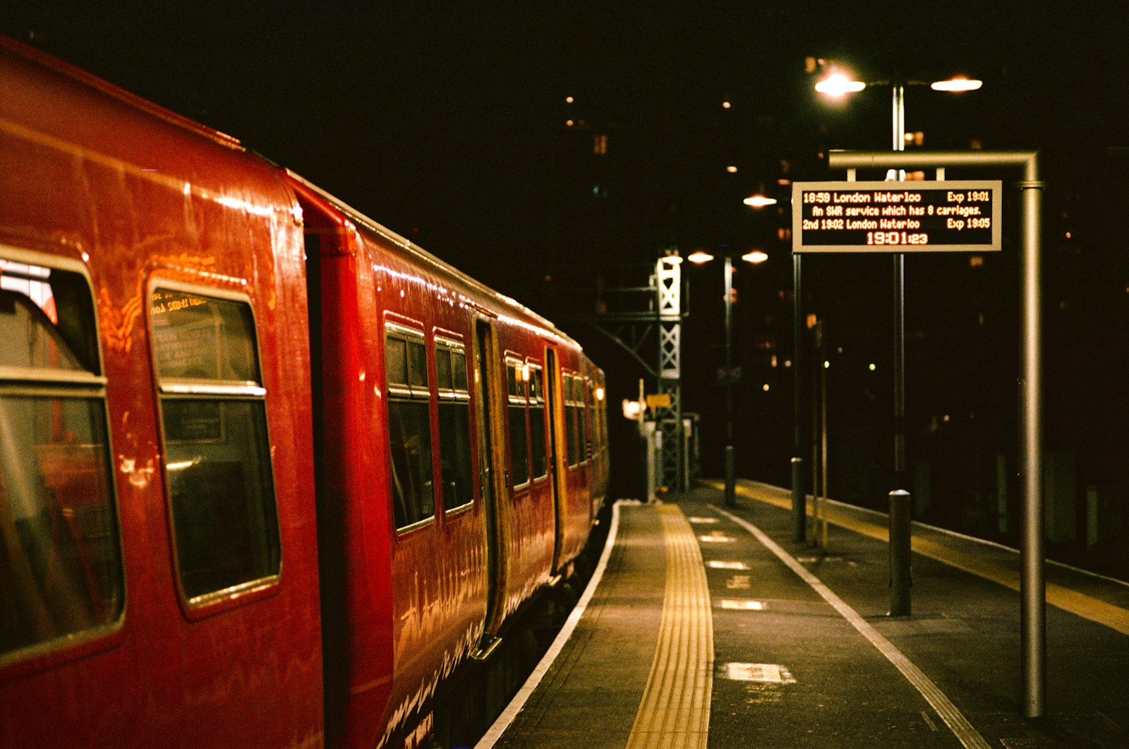 A train sits at a dark, empty station.
