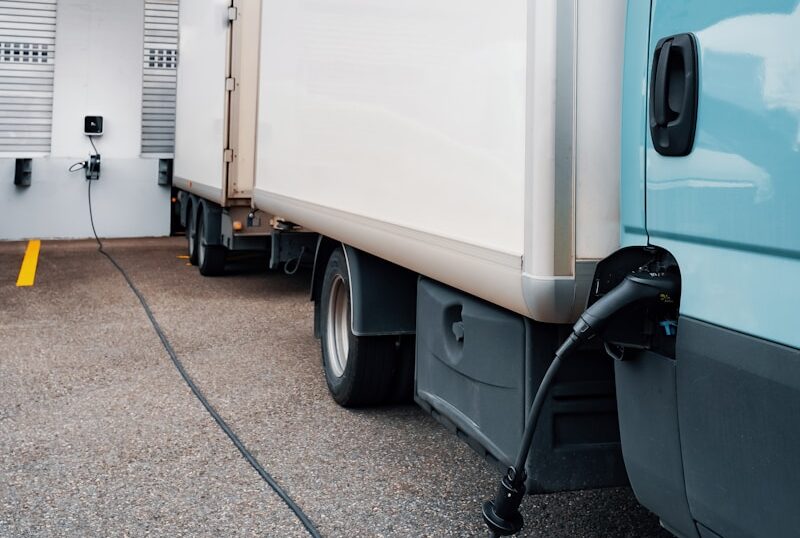 A blue truck parked in front of a building